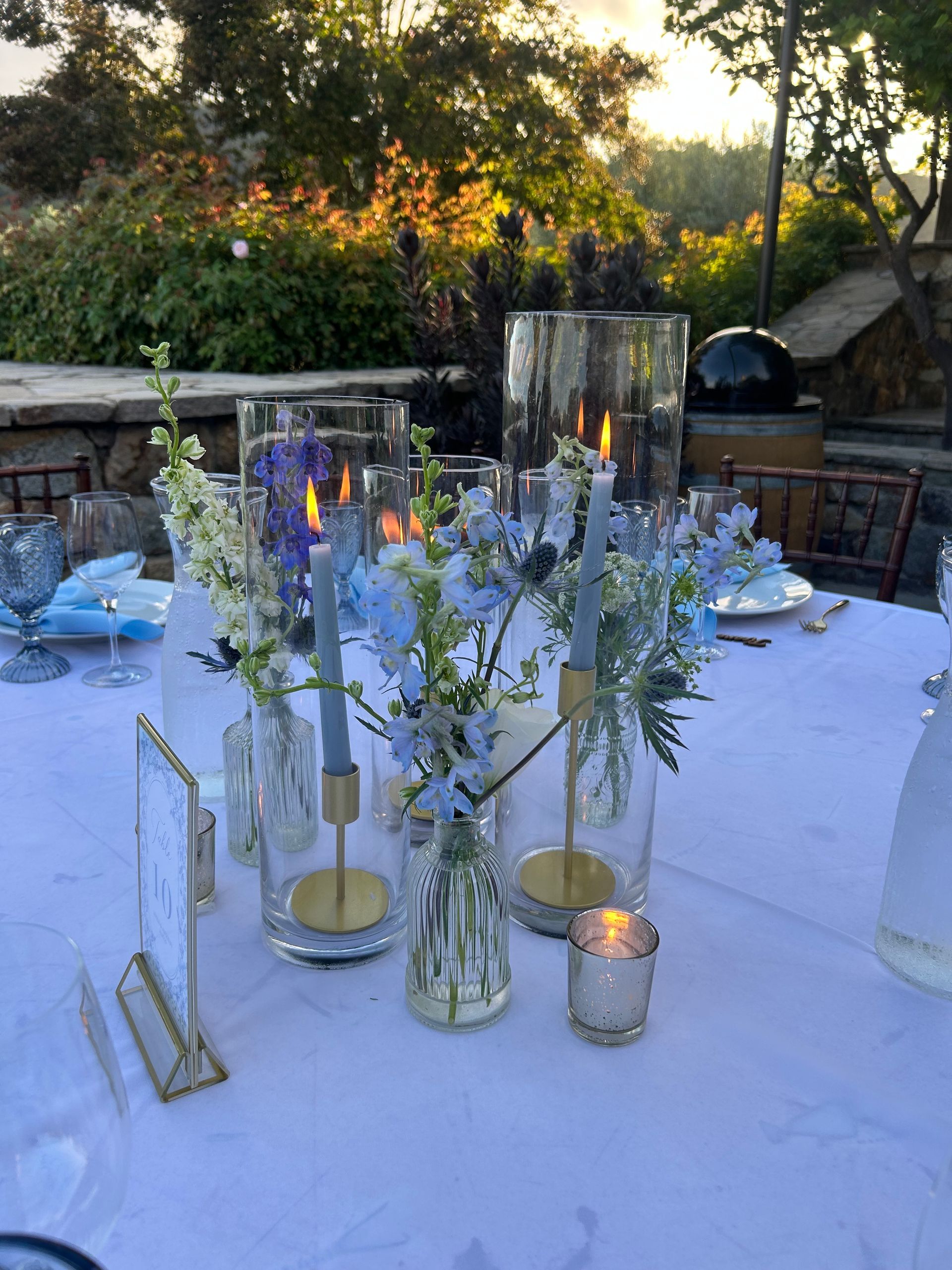 Bud vases and taper candles decor for the wedding tables
