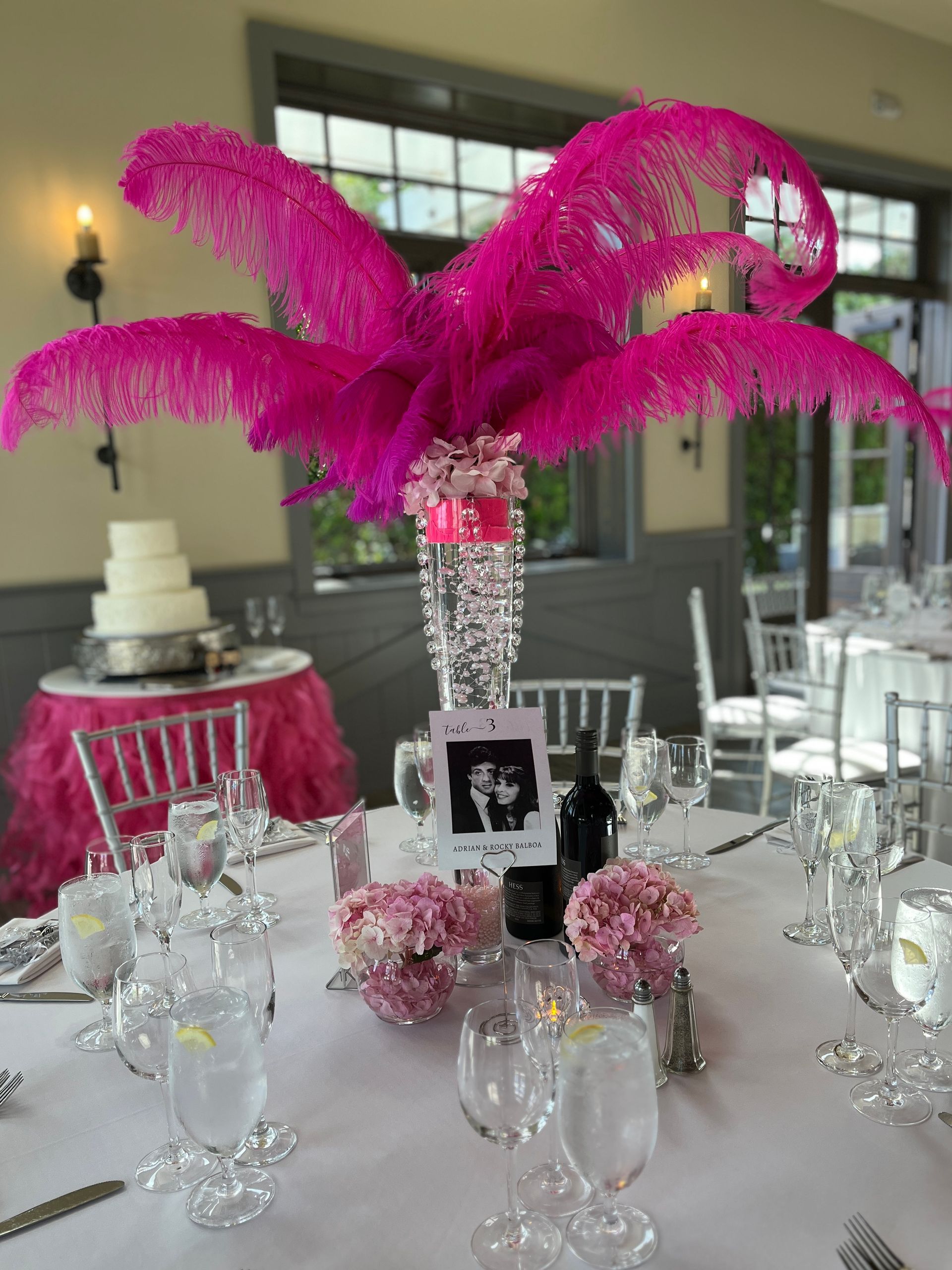 Tall centerpiece with hot pink feathers, modern, Las Vegas style