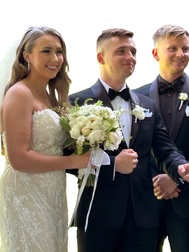Elegant bride's bouquet of lush white garden flowers. The groom's boutonniere is exquisite.