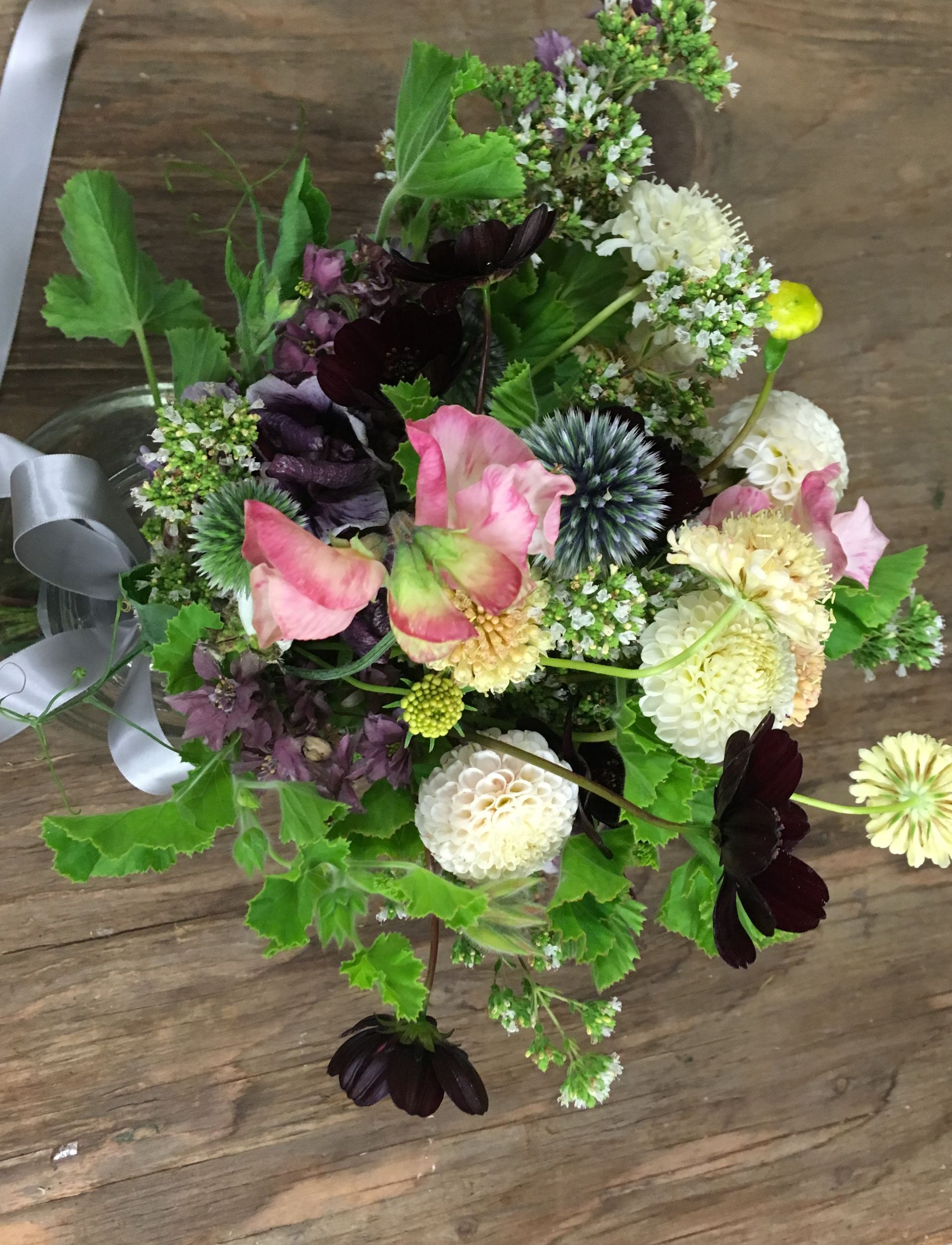 Wildflower bridal bouquet that is  full of herbs.