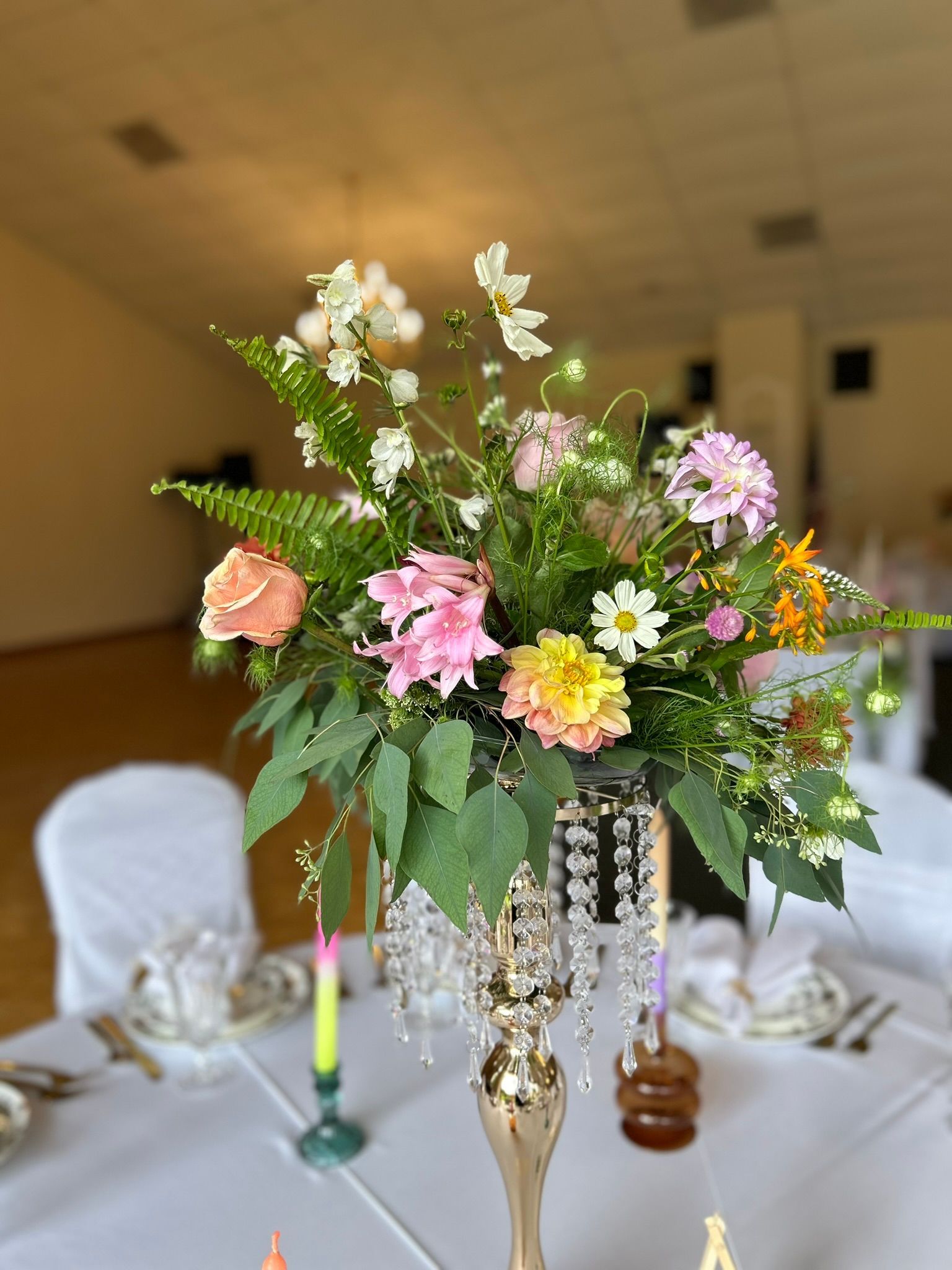 A vase filled with flowers is sitting on a table.