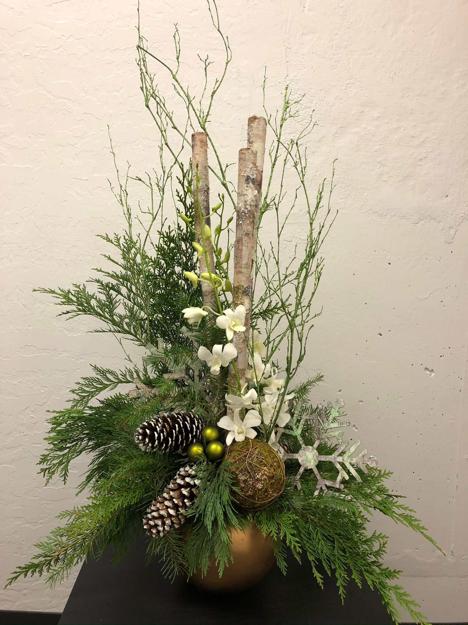 Christmas arrangement with branches and evergreens