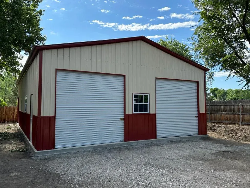a garage with two garage doors and a window