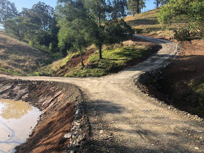 A Dirt Road With A Pond In The Middle Of It — Arnway Pty Ltd In Kempsey, NSW