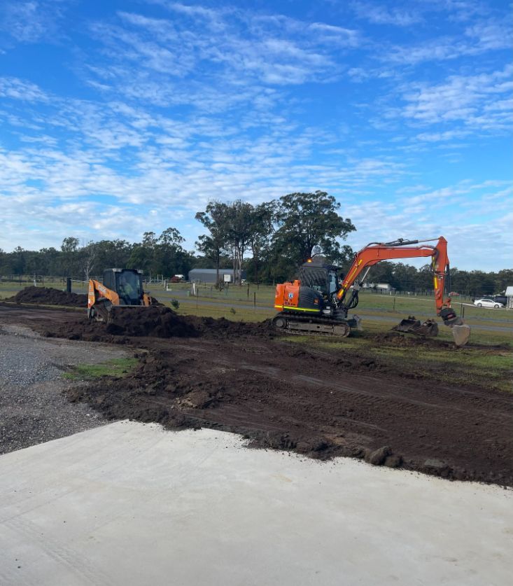 A Large Excavator Is Working On A Pond Surrounded By Trees — Arnway Pty Ltd In Kempsey, NSW