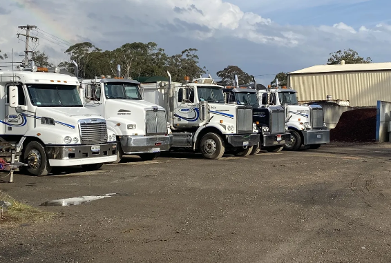 A Row Of Semi Trucks Parked In A Parking Lot — Arnway Pty Ltd In Kempsey, NSW 