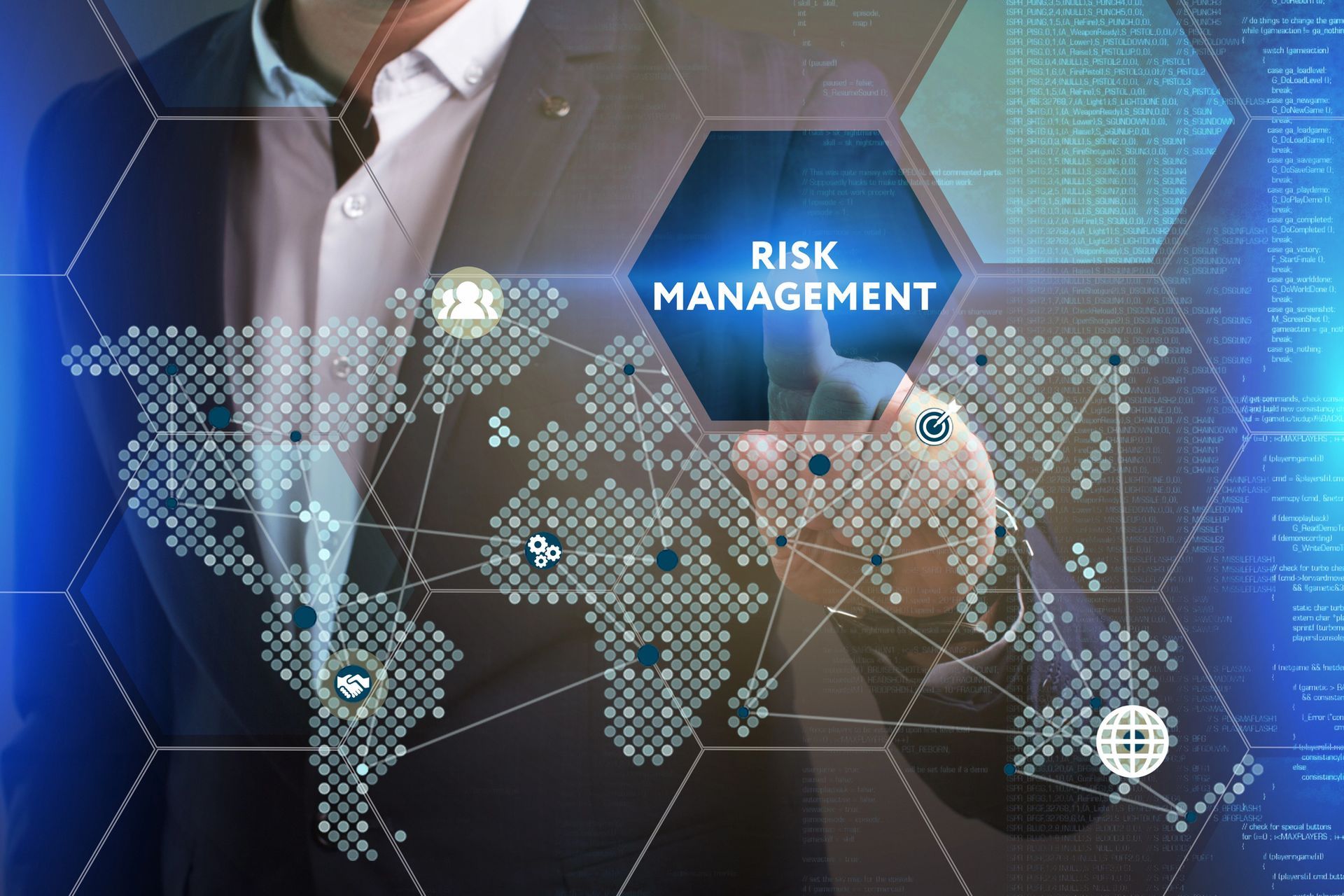 A group of people are sitting at a table using a laptop and a tablet.