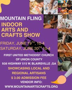 Art fair: people browse booths inside and outside a building. Artwork, decor, and tents are visible.