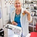 Woman in Sewing Machine — Authorized Dealer in Pensacola FL
