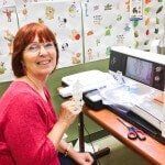 Woman in Red Smiling — Authorized Dealer in Pensacola FL