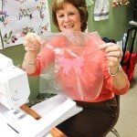 Woman showing her craft — Authorized Dealer in Pensacola FL