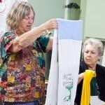 Two woman checking their work — Authorized Dealer in Pensacola FL