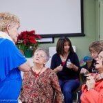 Woman telling something to everyone — Authorized Dealer in Pensacola FL