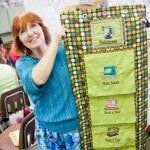 Woman Holding Green Fabric — Authorized Dealer in Pensacola FL