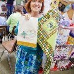 Woman Showcasing her Work — Authorized Dealer in Pensacola FL