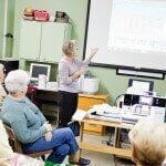 Woman Listening to the Presenter — Authorized Dealer in Pensacola FL