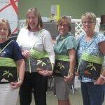 Group of woman taking picture — Authorized Dealer in Pensacola FL