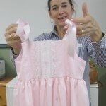 Woman Holding Girl Cloth — Authorized Dealer in Pensacola FL