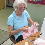 Old woman smiling — Authorized Dealer in Pensacola FL