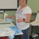 Woman smiling while working — Authorized Dealer in Pensacola FL