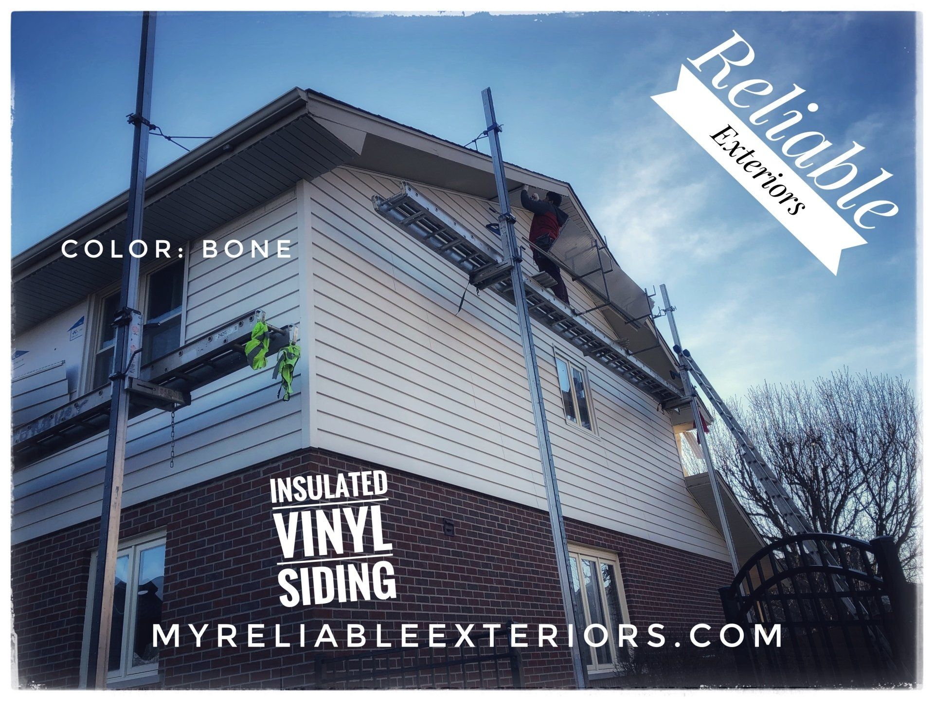 A house is being painted with insulated vinyl siding