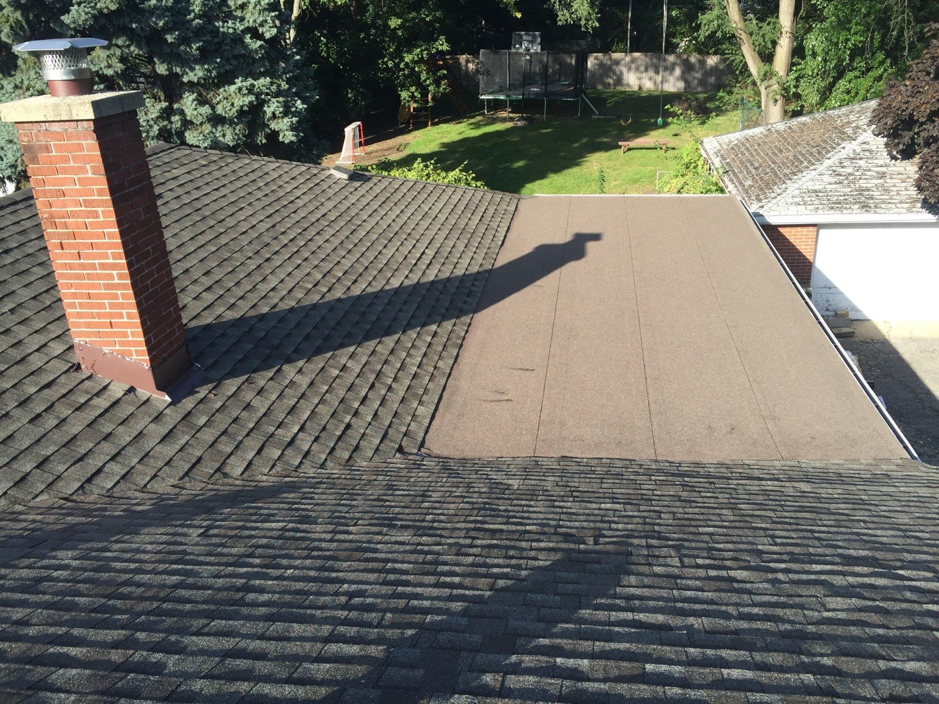 A roof with a chimney on top of it