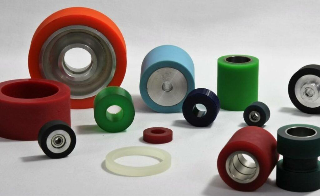 Close-up of a metalworking machine with a rotating wheel and polished metal components.