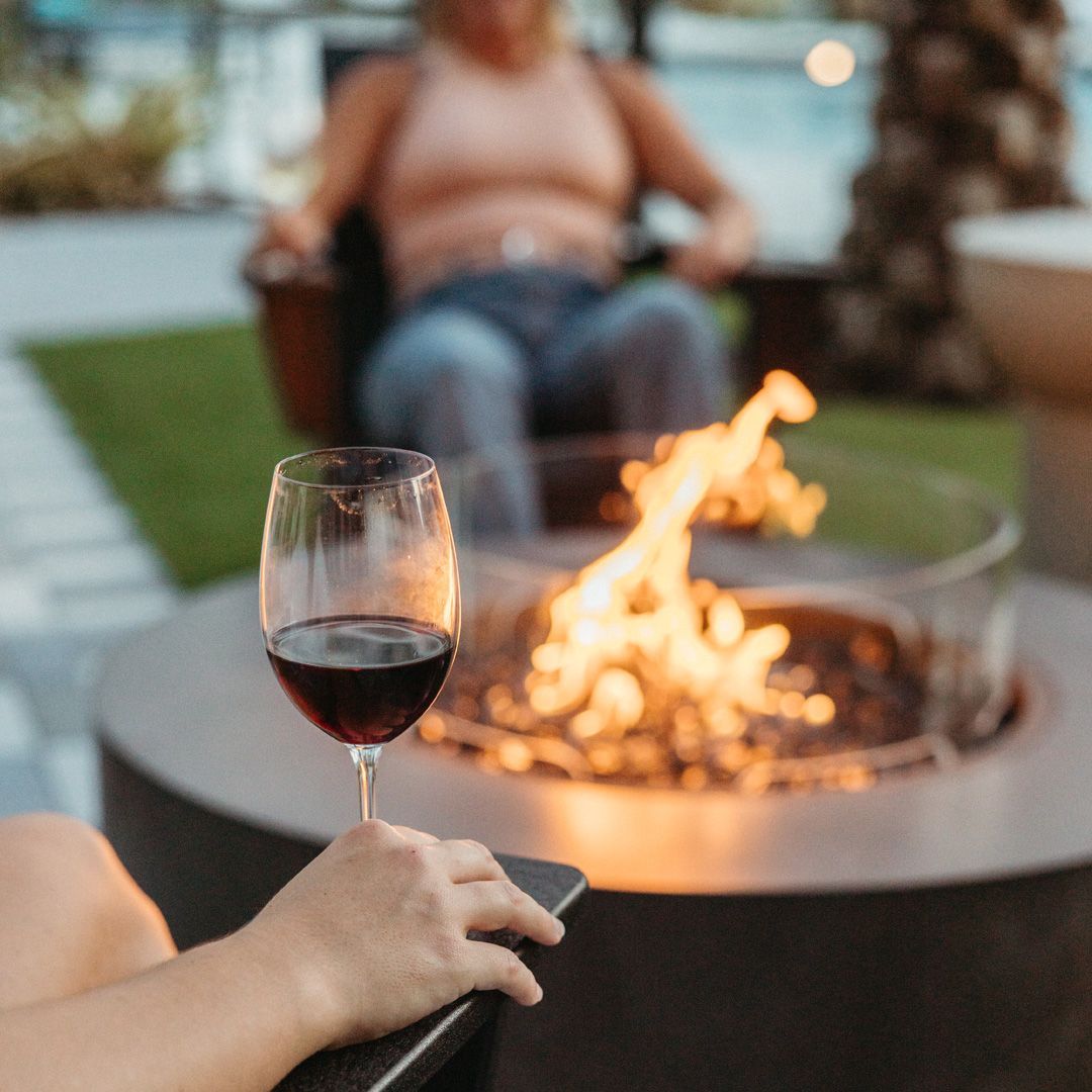 People sitting around the fire pit.