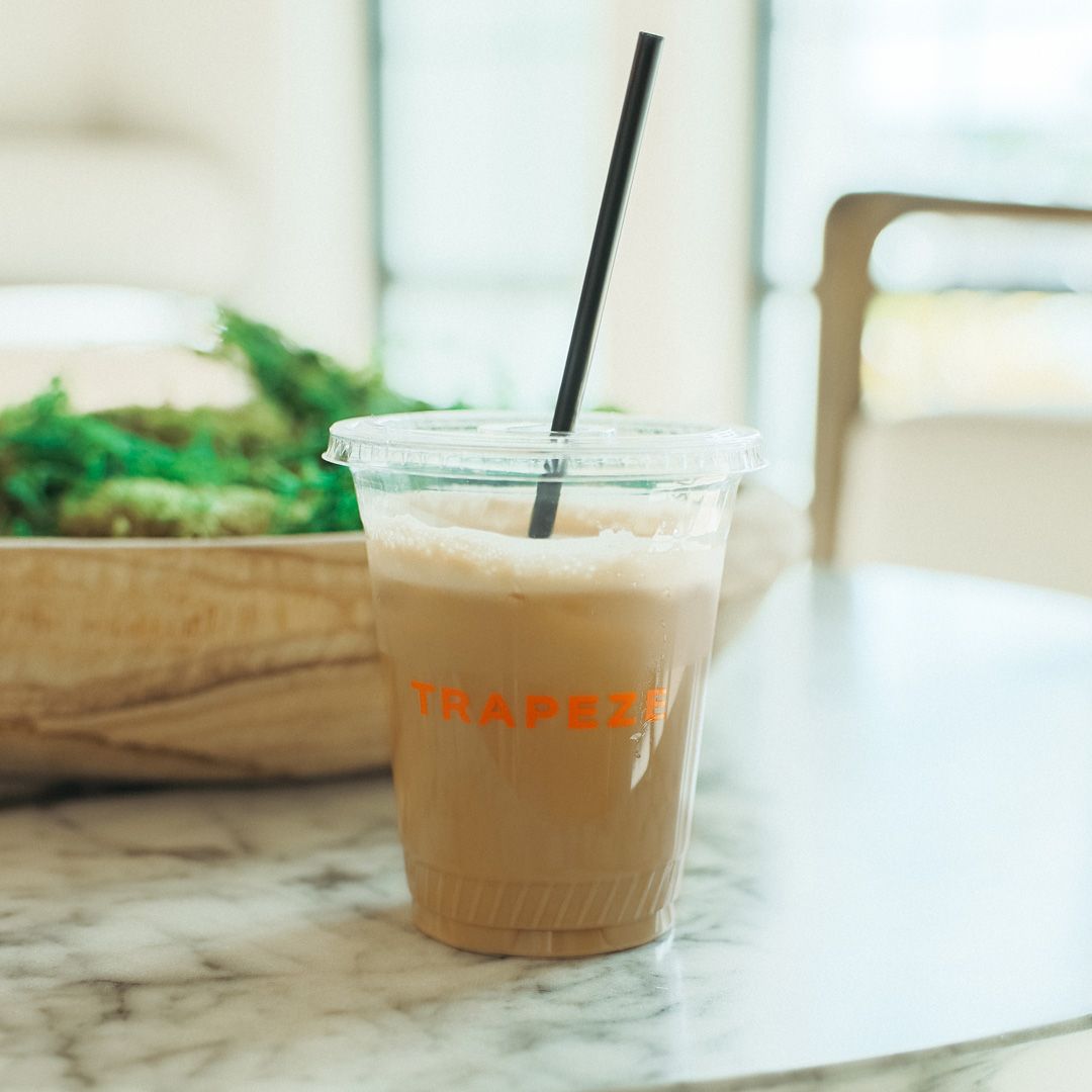 A cup of coffee on the table.