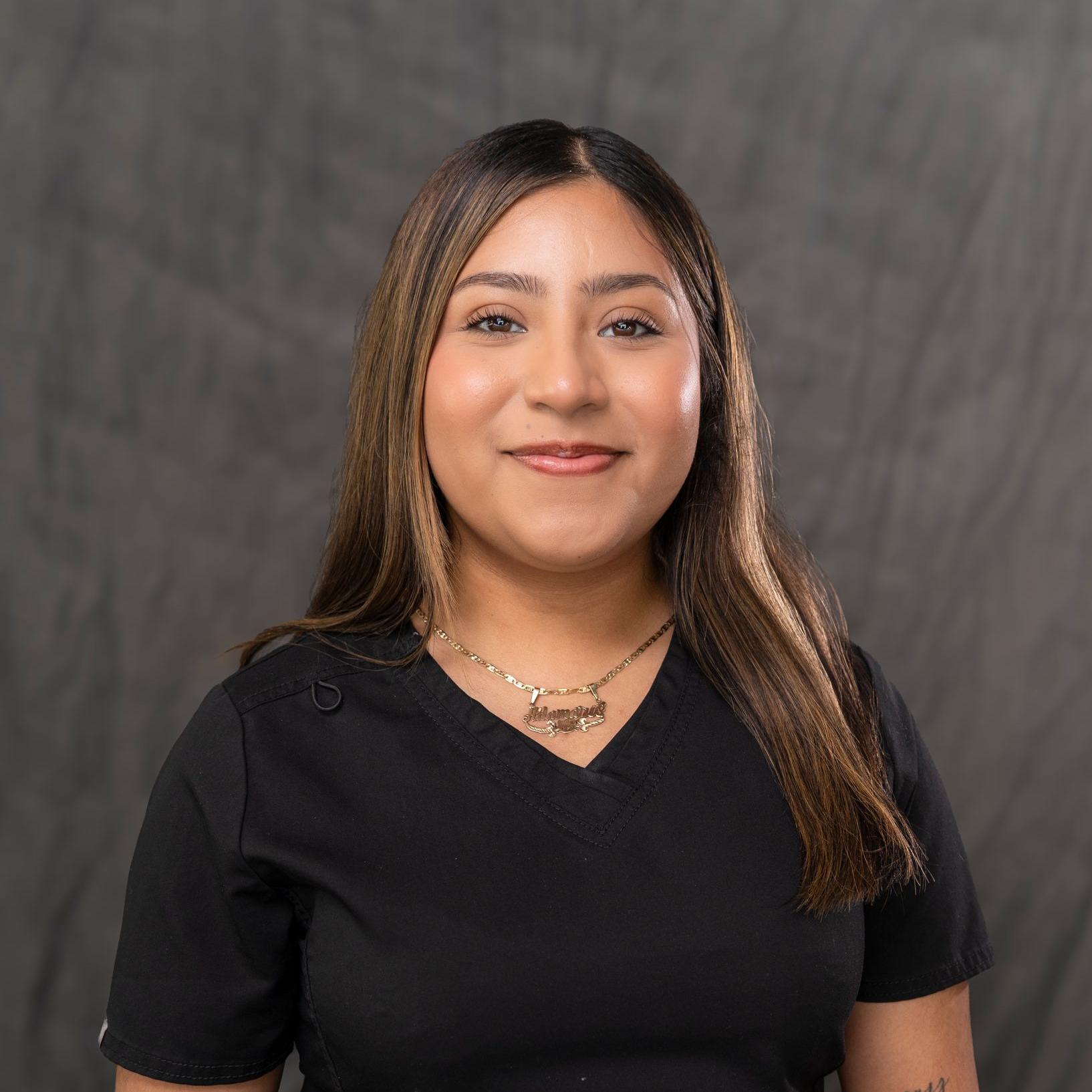 a man in a suit and tie is standing in front of a white car .
