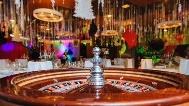 A close up of a roulette wheel in a casino.