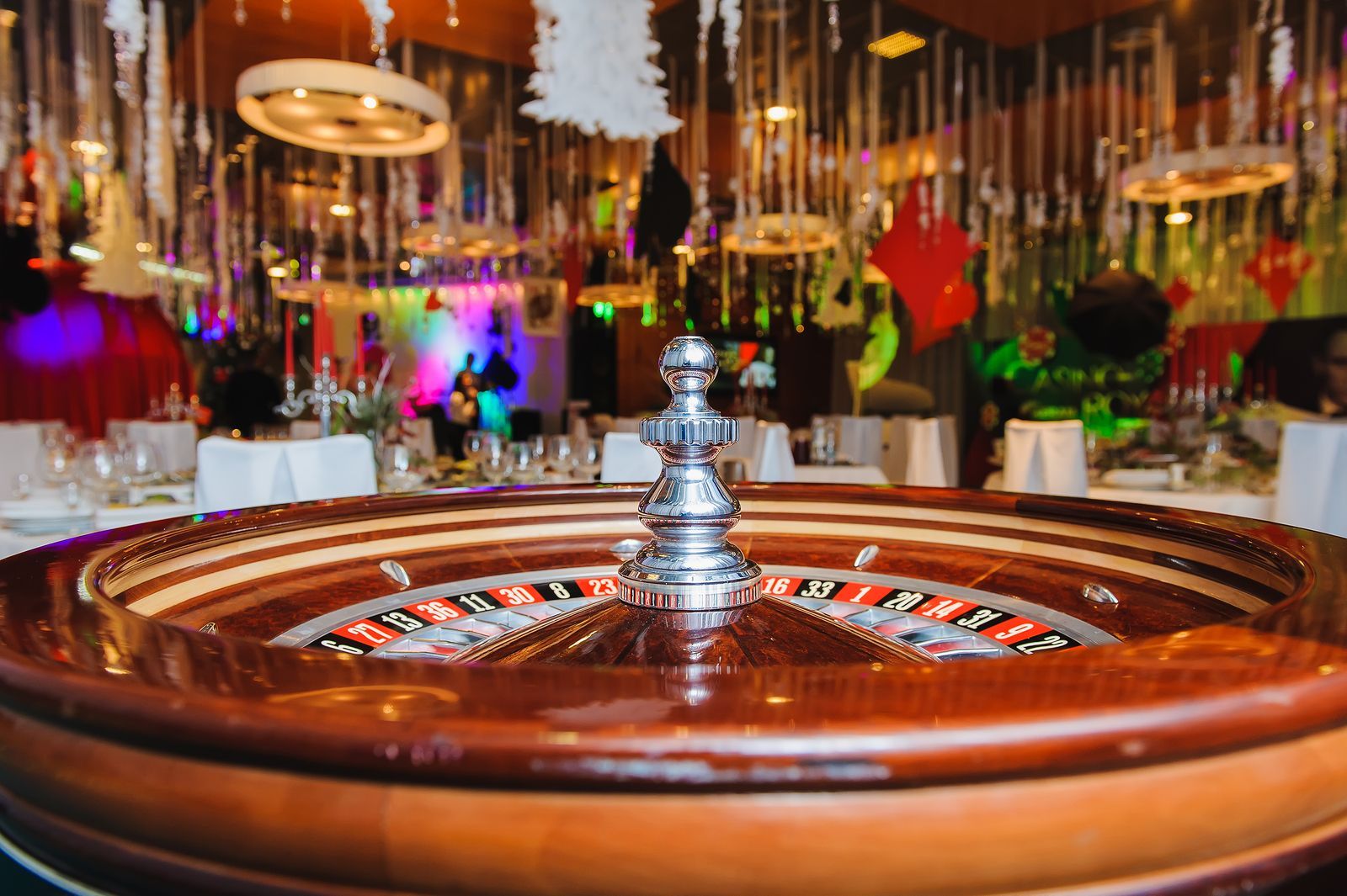 A close up of a roulette wheel in a casino.