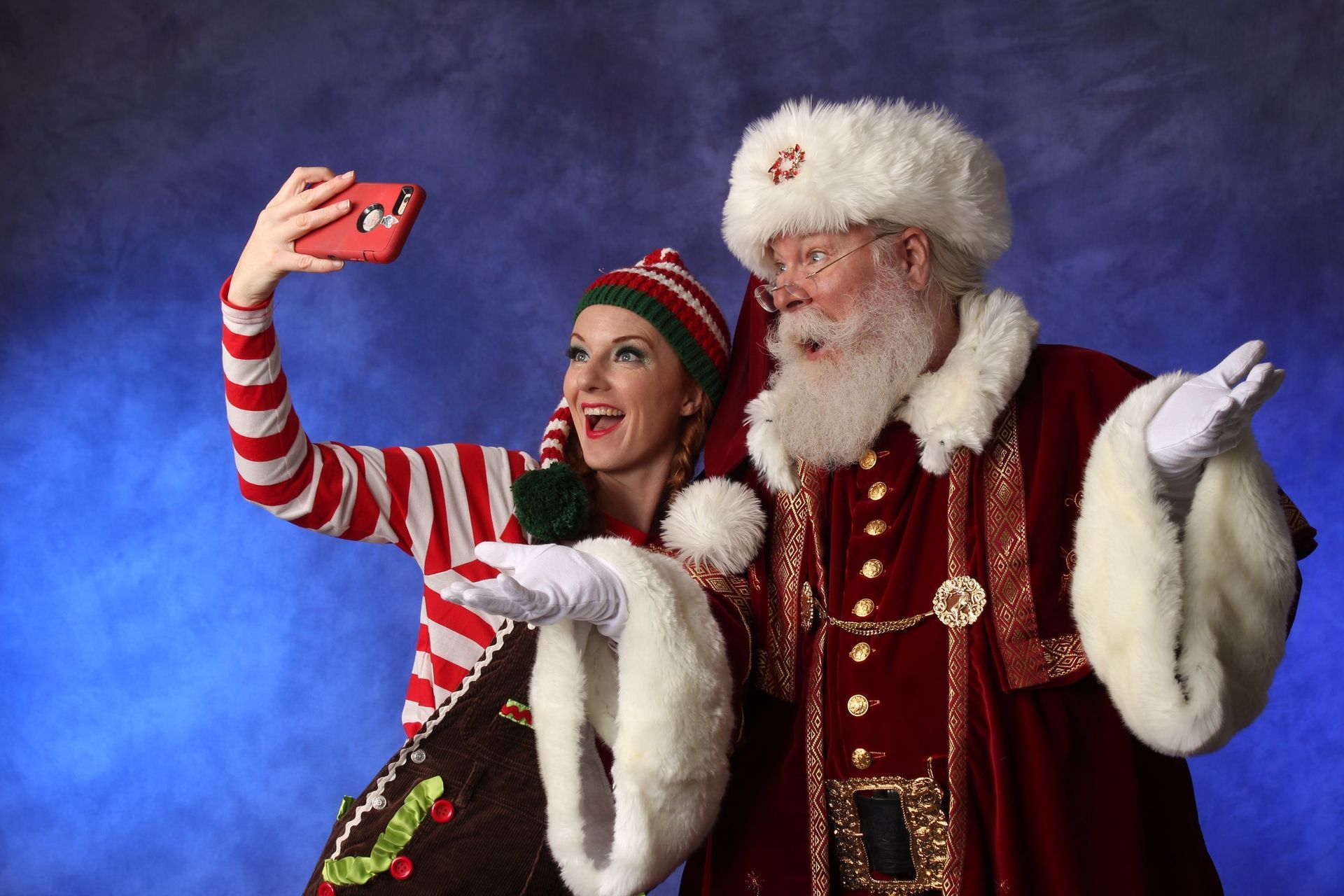Santa at a holiday corporate event posing with a guest