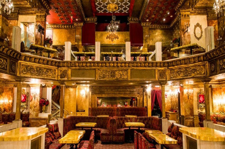 A large room with tables and chairs in it