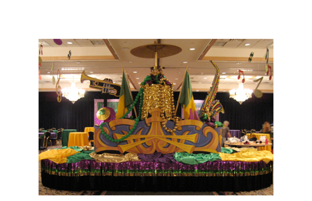 A mardi gras float is sitting on top of a table in a room.