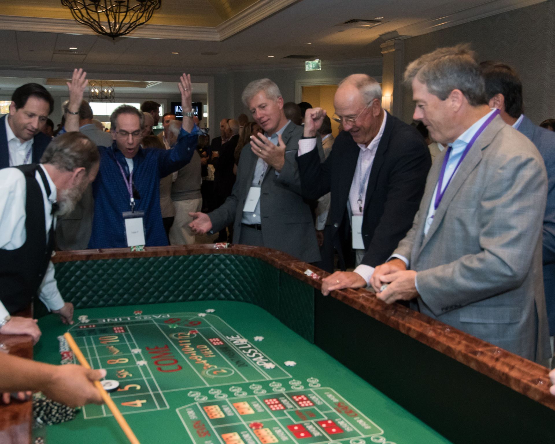 A group of men are playing roulette in a casino
