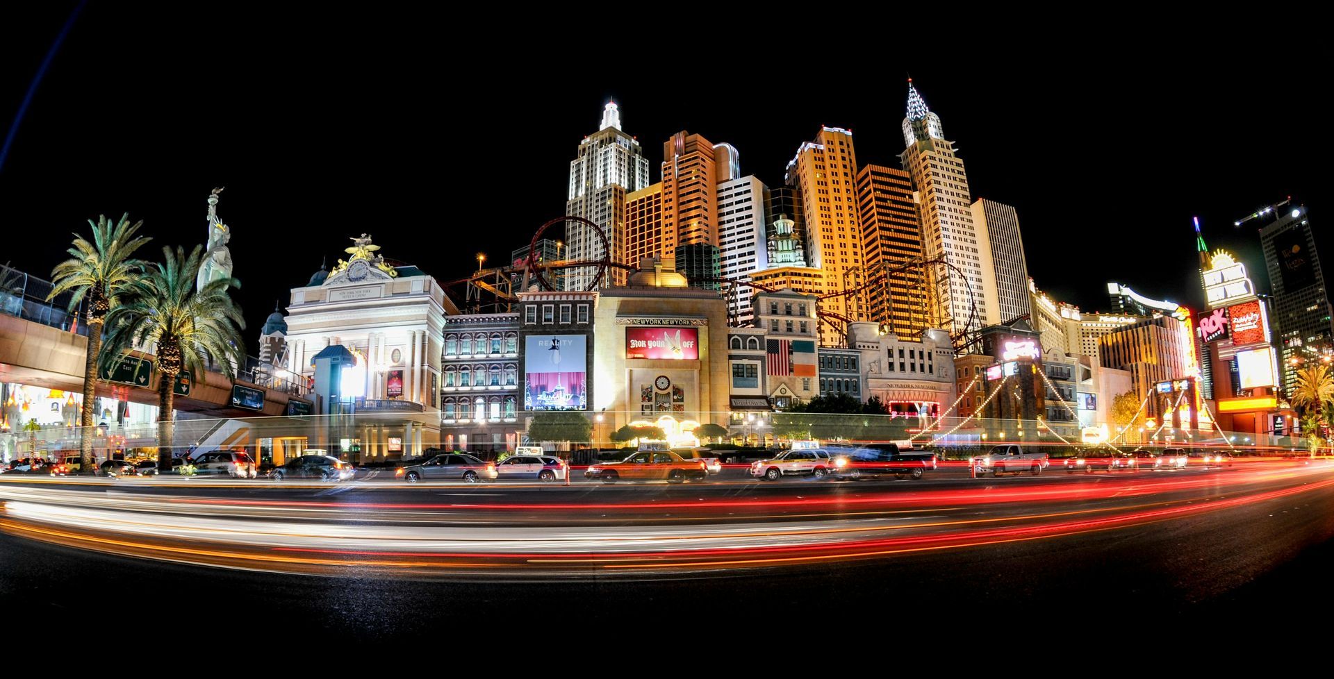 A long exposure photo of a city skyline at night.