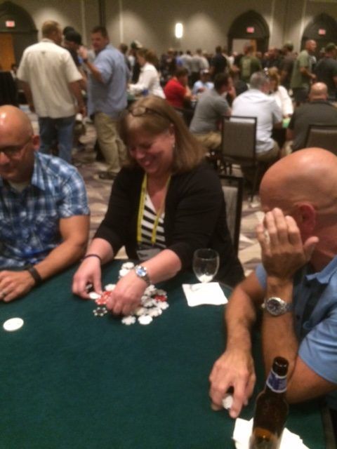 A group of people are playing a game of poker