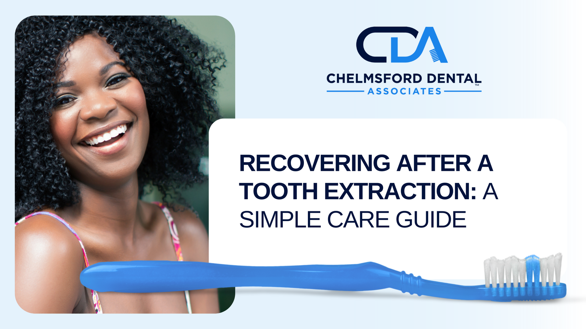 A woman is smiling while holding a blue toothbrush