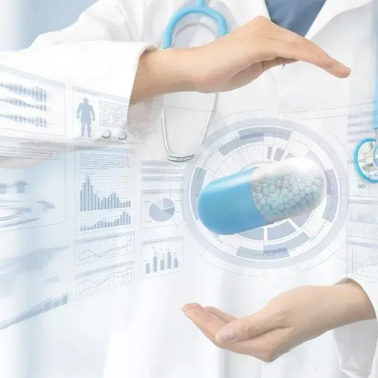 Doctor with stethoscope holding a 3D capsule, surrounded by data visualizations.