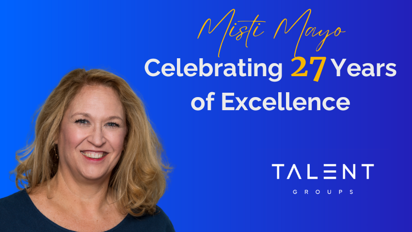 A professional headshot of Misti Mayo against a blue background, celebrating 27 years of excellence with Talent Group.
