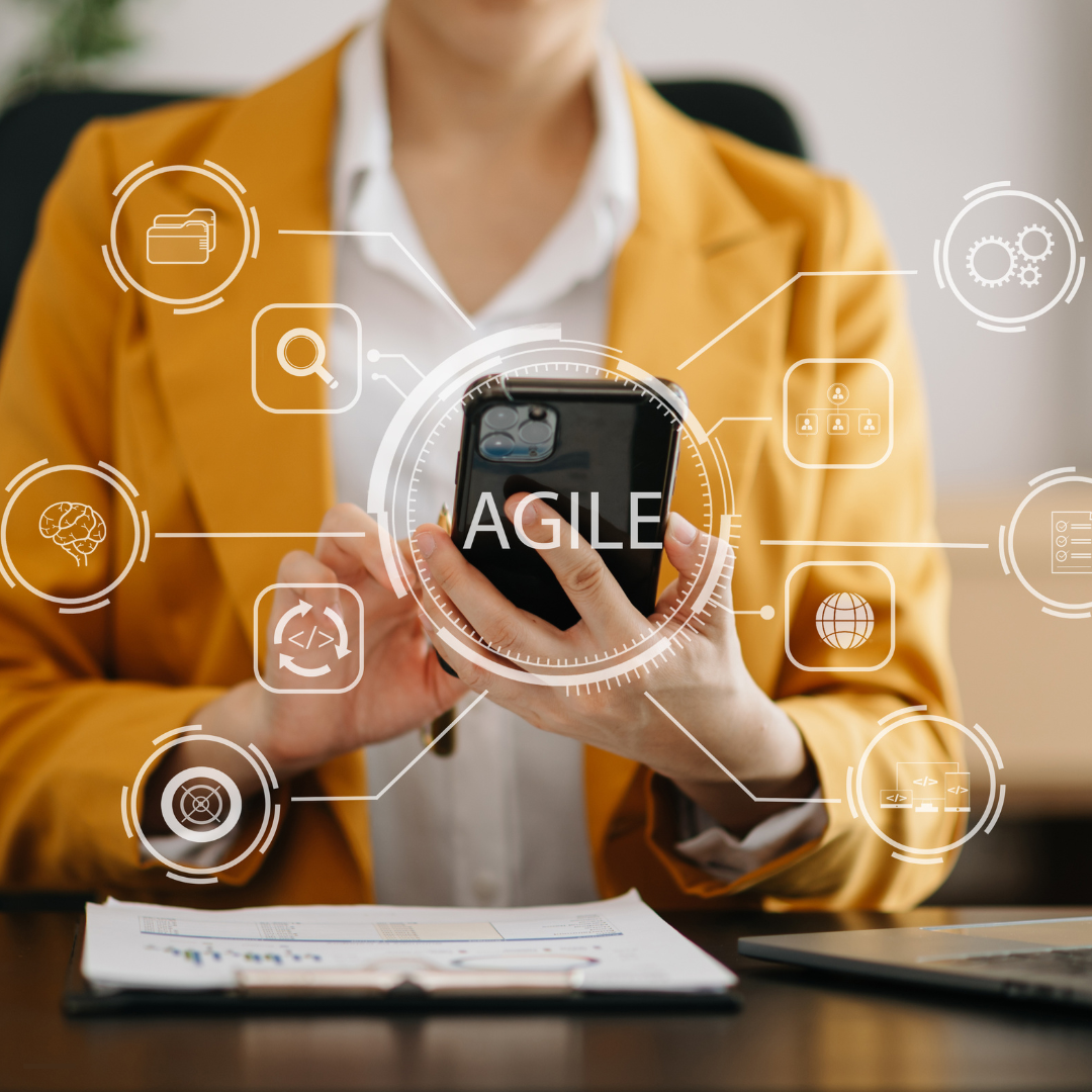 Woman in yellow jacket holds smartphone with 