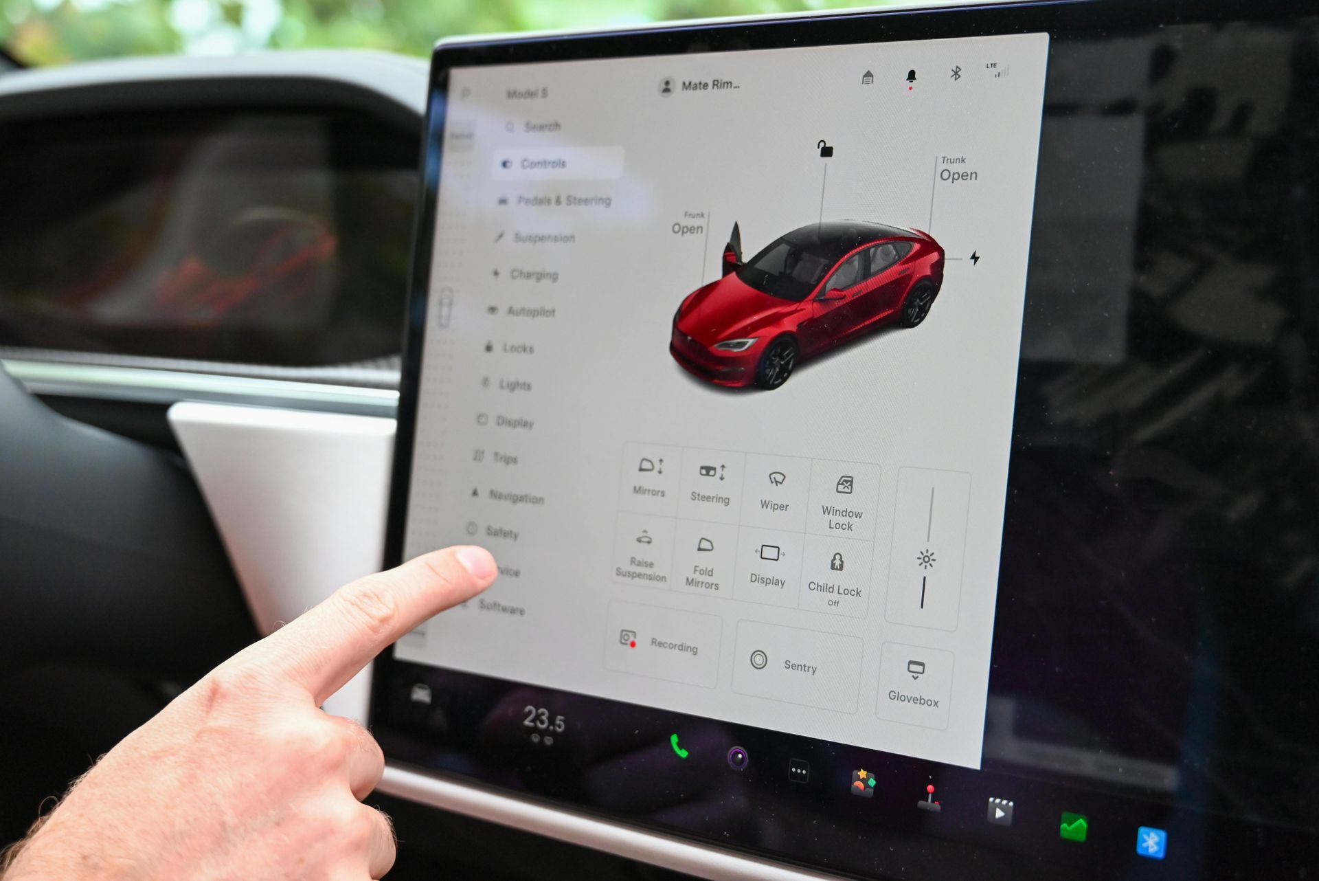 The inside of an empty bus with blue seats