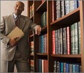 Lawyer standing by books