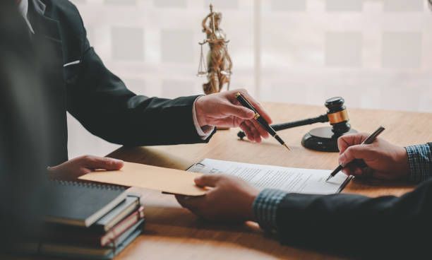 Person signing a document.