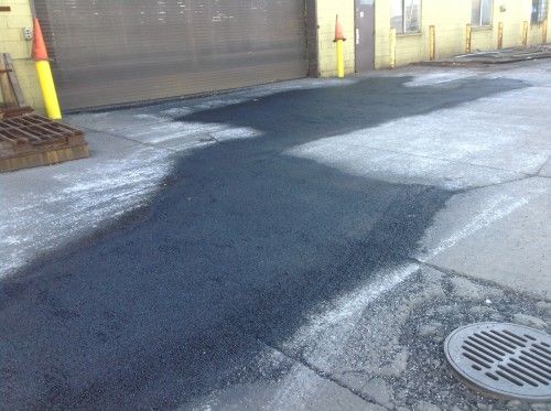 There is a lot of asphalt on the side of the road.