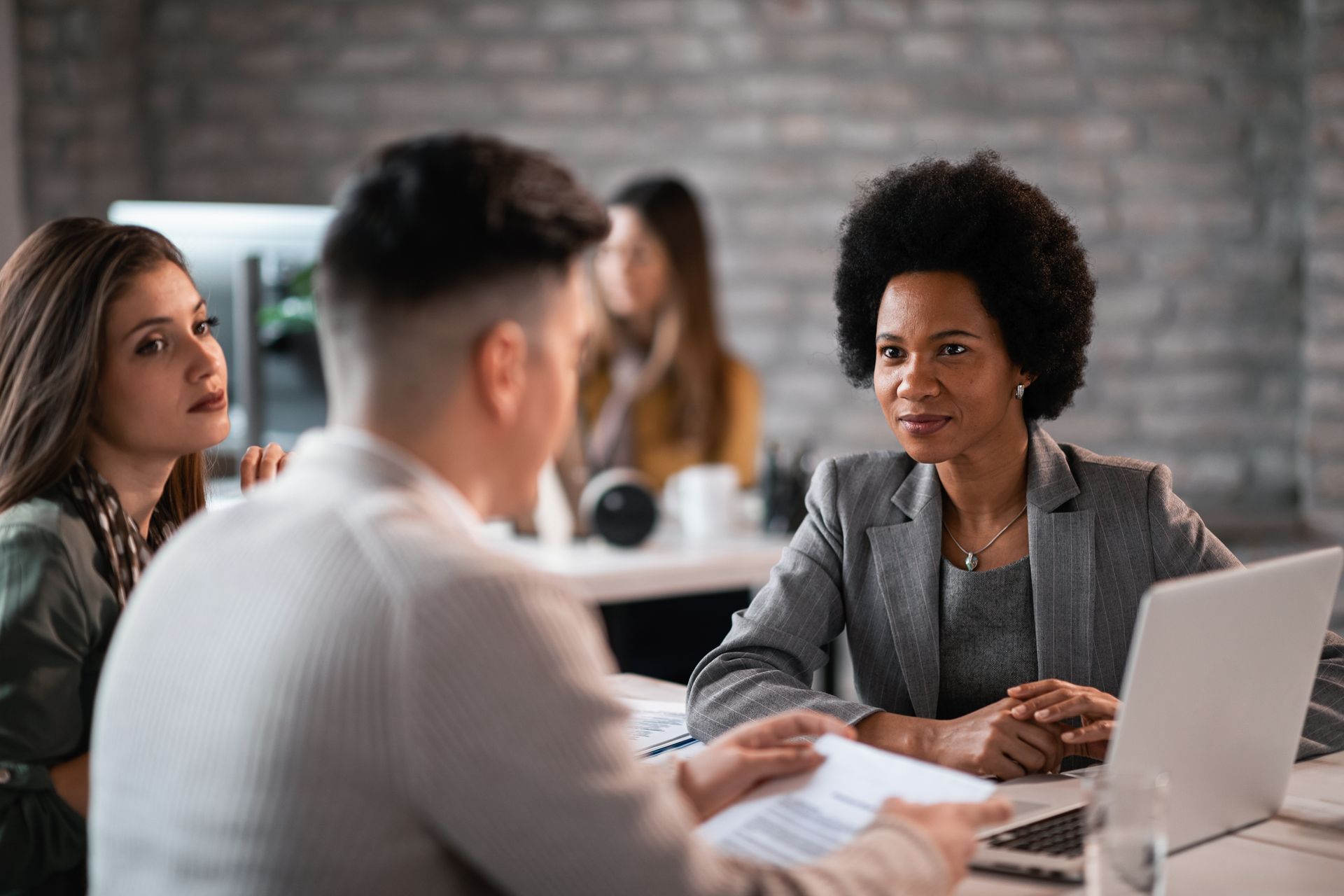 Young couple consulting with a paralegal for affordable family law support in Ontario