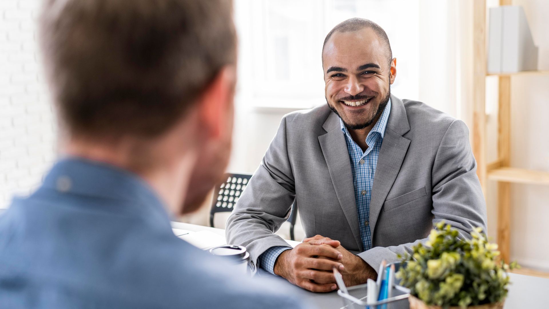 Paralegal helping a client resolve legal paperwork with care and clarity