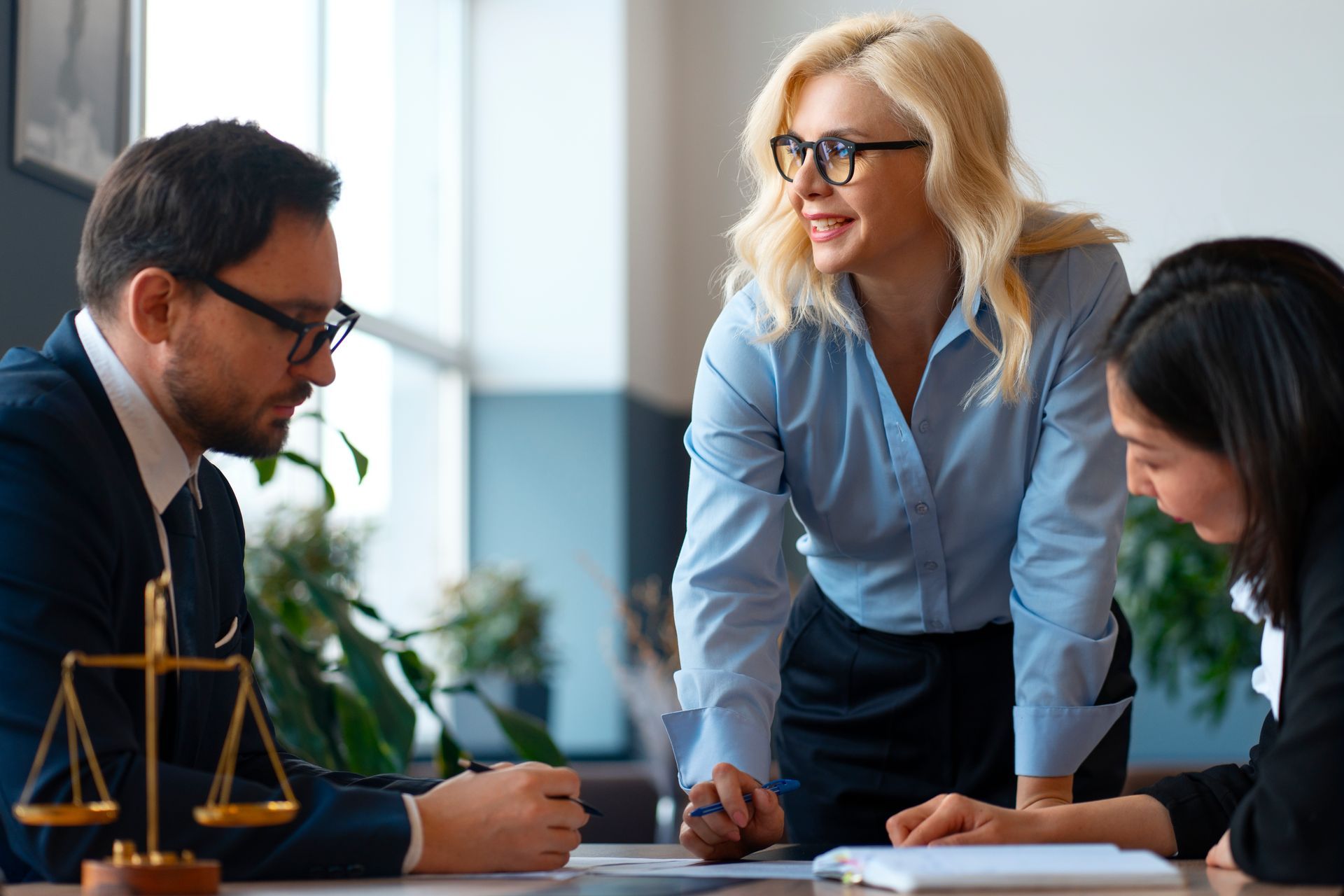 Ontario paralegal team consulting on a landlord’s eviction case with legal documents 