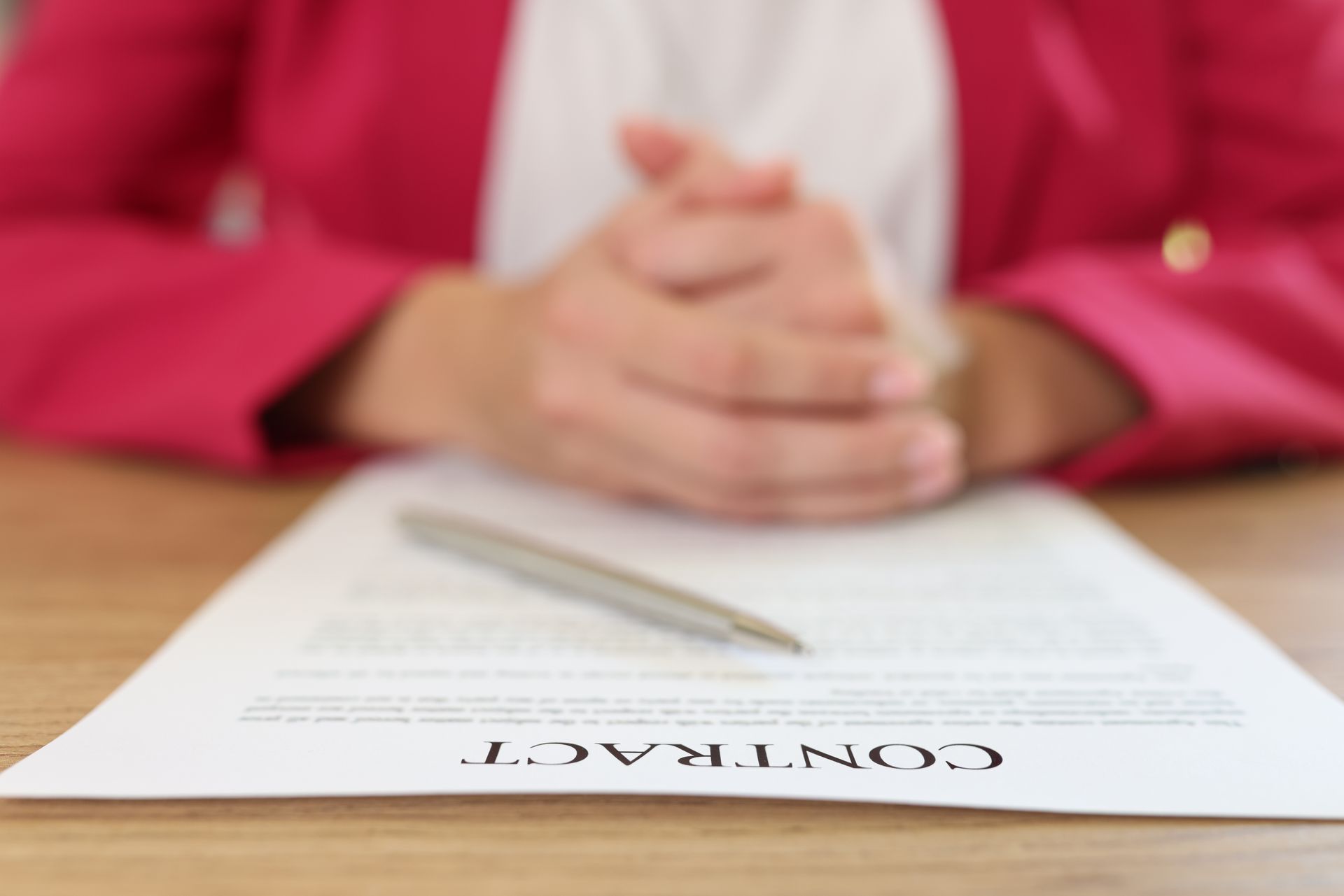 Close-up of a signed contract representing common Small Claims Court disputes in Ontario such as unpaid invoices, loans, and contract breaches.